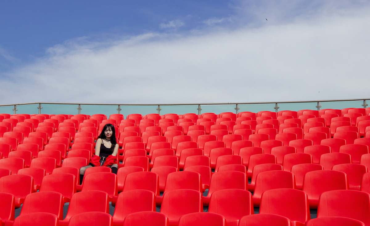 interior design woman sitting on red chair\ chair